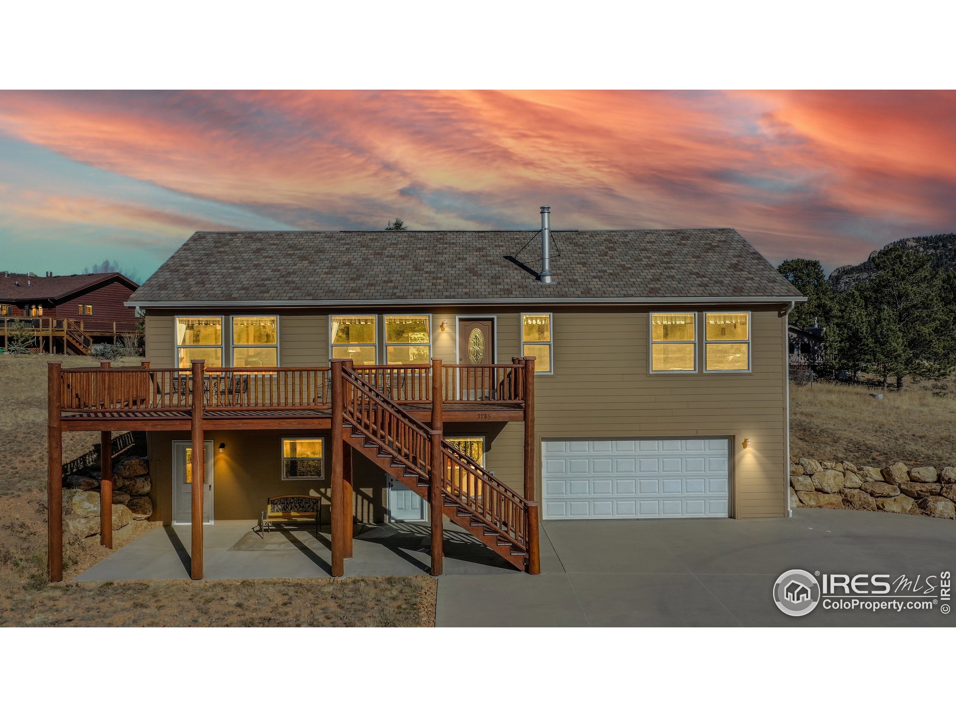 Lovely south-facing home with large deck to take in the views both day and night