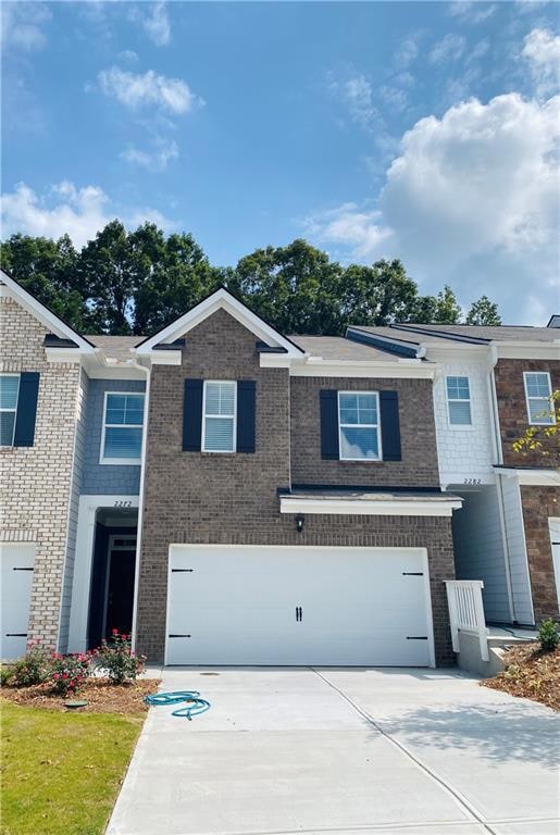View of property featuring a garage