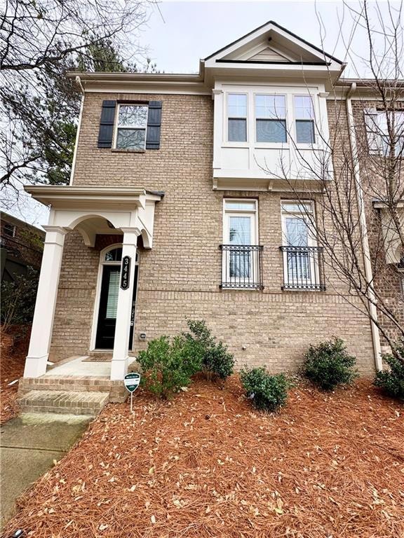 View of front of house featuring brick siding