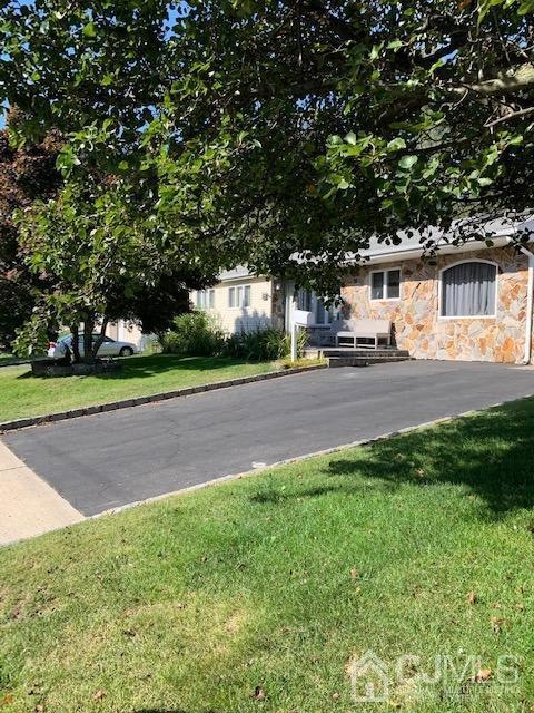 Great photo to show the property and double wide driveway.