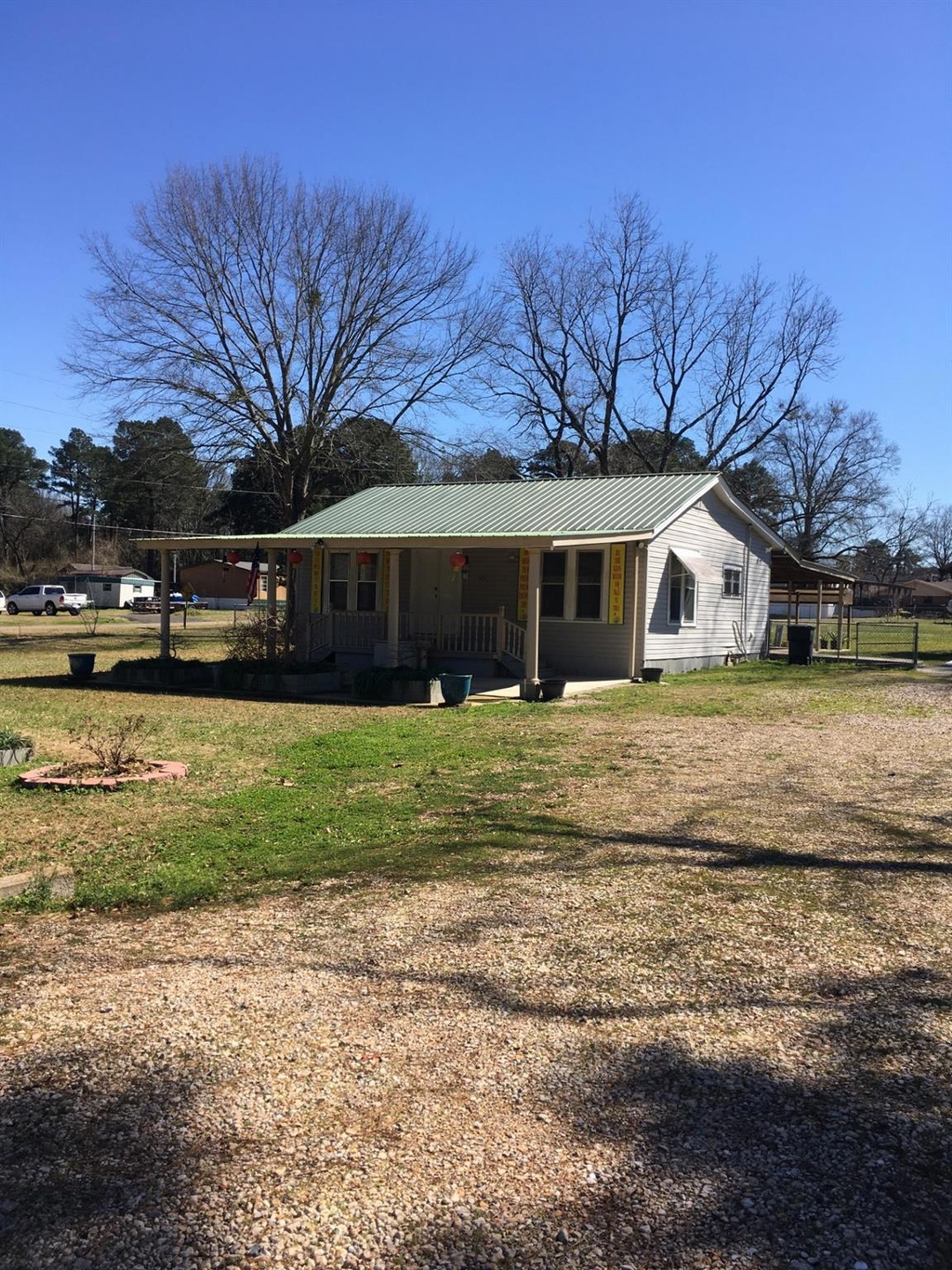 View of front of property with metal roof, a porch