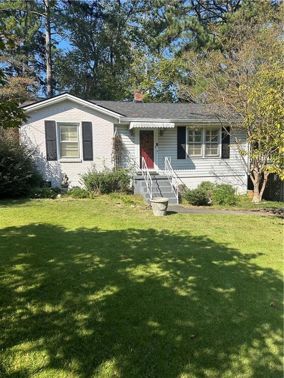 View of front of house with a front lawn