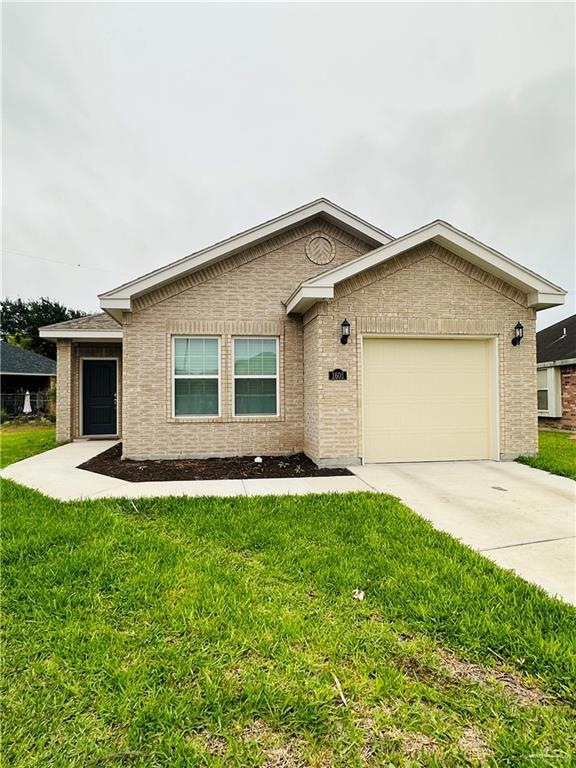 Ranch-style house with a garage and a front yard