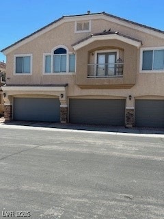 View of front of property featuring stucco siding,
