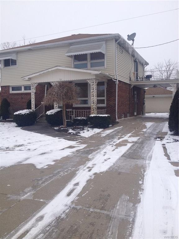 Front entrance, covered porch.  Double wide drivew
