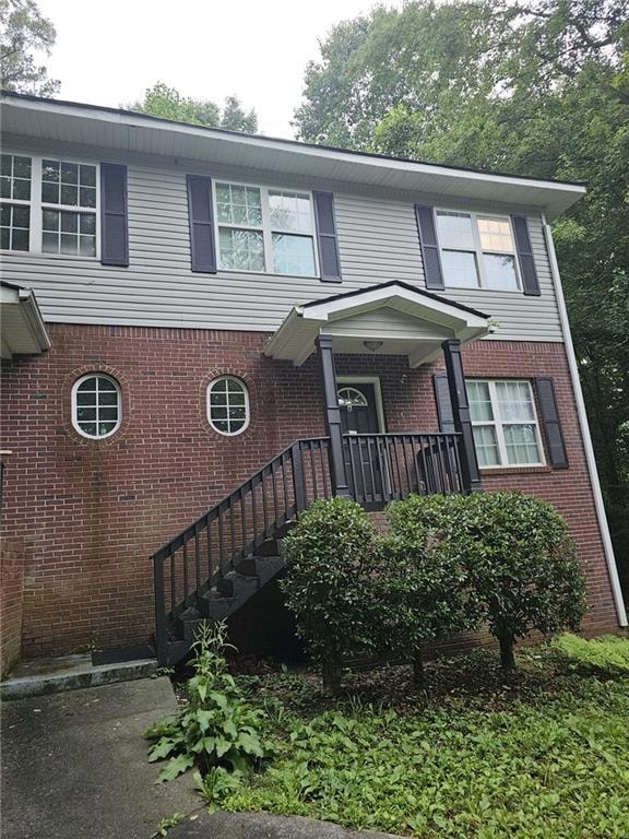View of front of property featuring brick siding