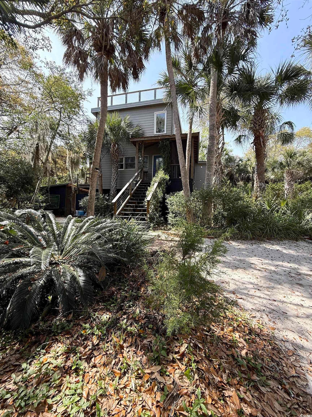 Back of house featuring stairway