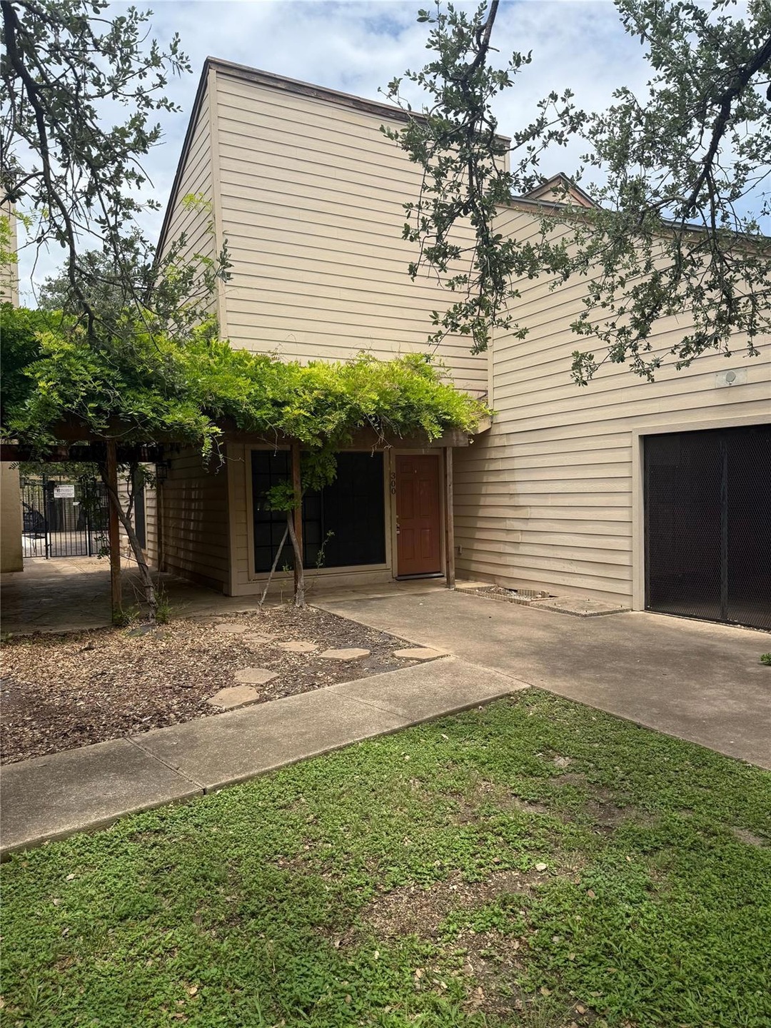 View of front facade with driveway and a garage