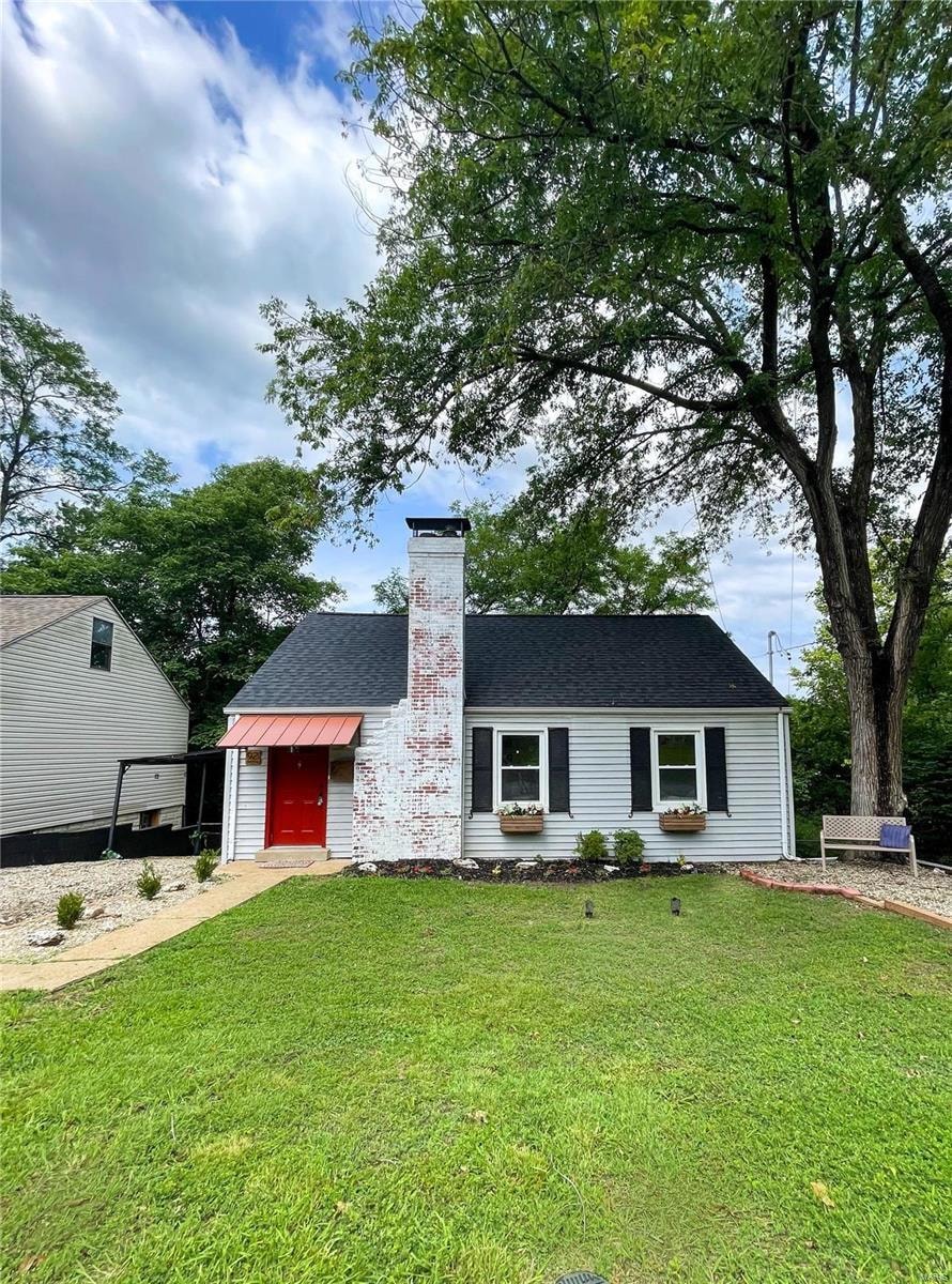 A stunning red door and copper portico welcome you in! The front offers two driveways as well as lots of street parking.