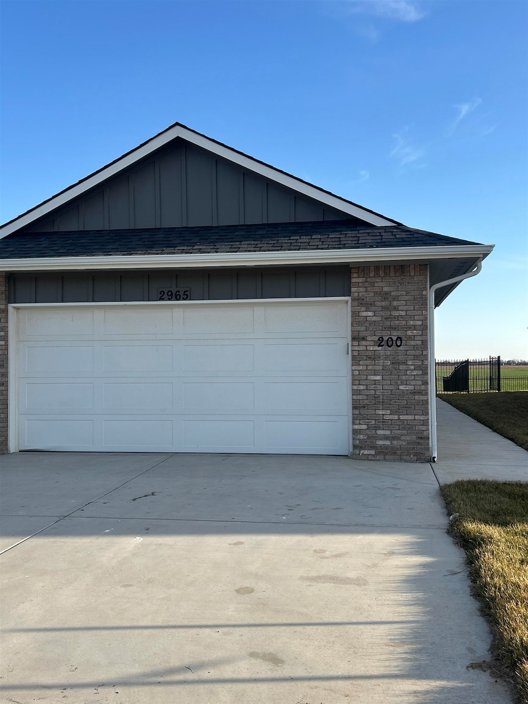 Garage featuring fence
