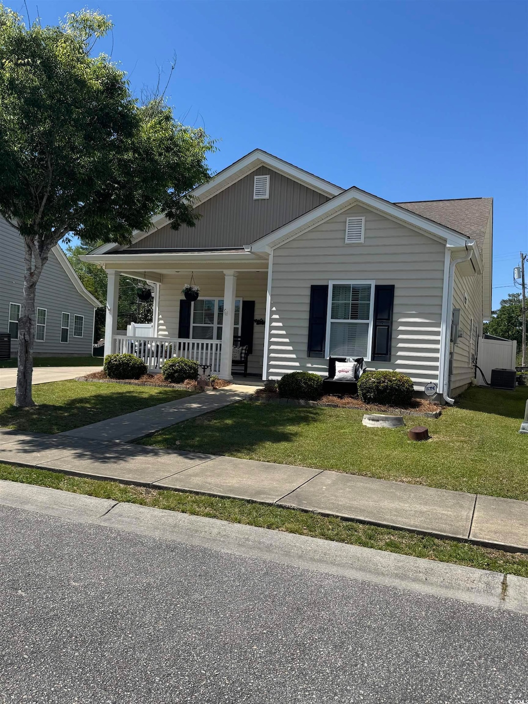 Bungalow-style house featuring a front lawn and a 