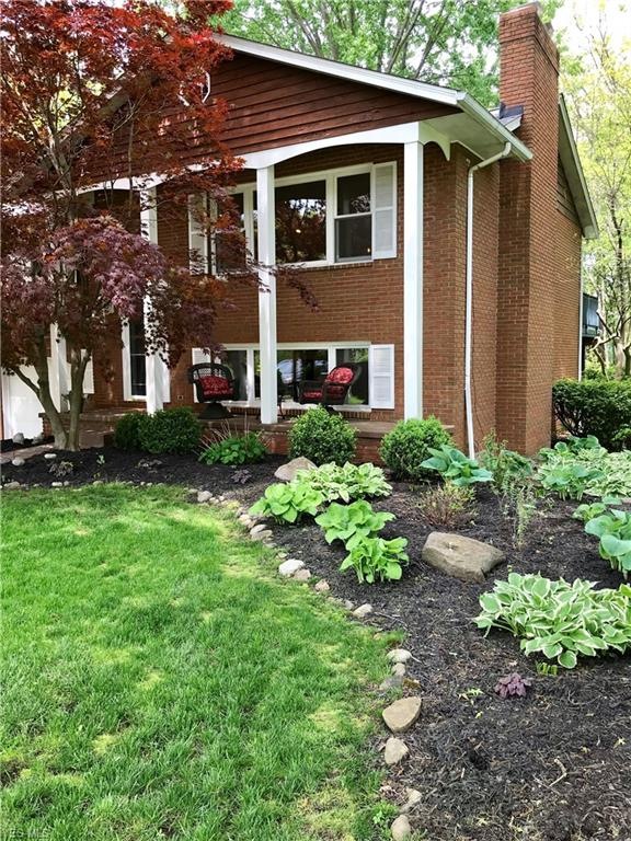 Wonderful home welcoming front porch and 2 brick f