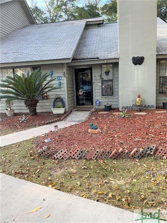 front yard has lots of landscaping