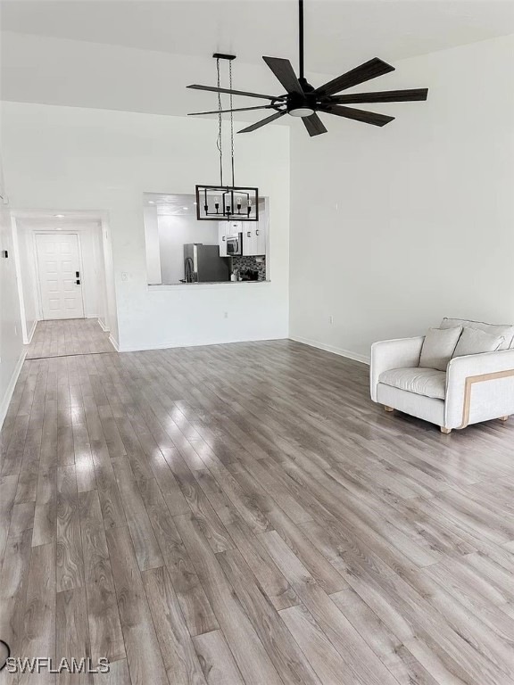 Unfurnished room with wood finished floors, a ceil