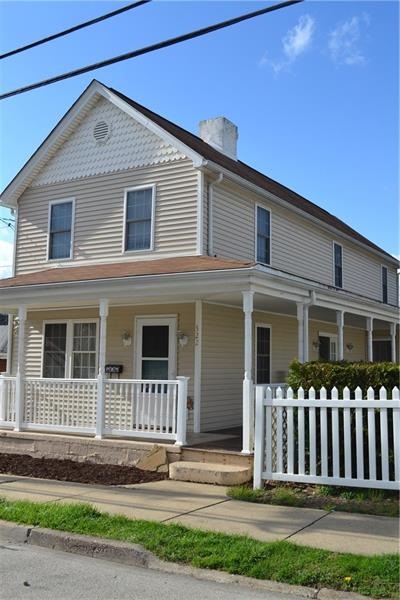 Charming curb appeal with wrap around front porch 
