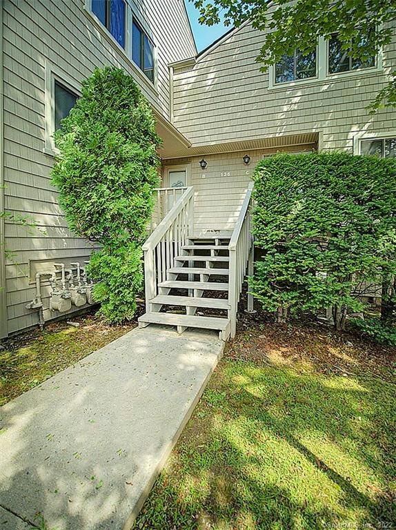 Stairs to shared deck for entry.