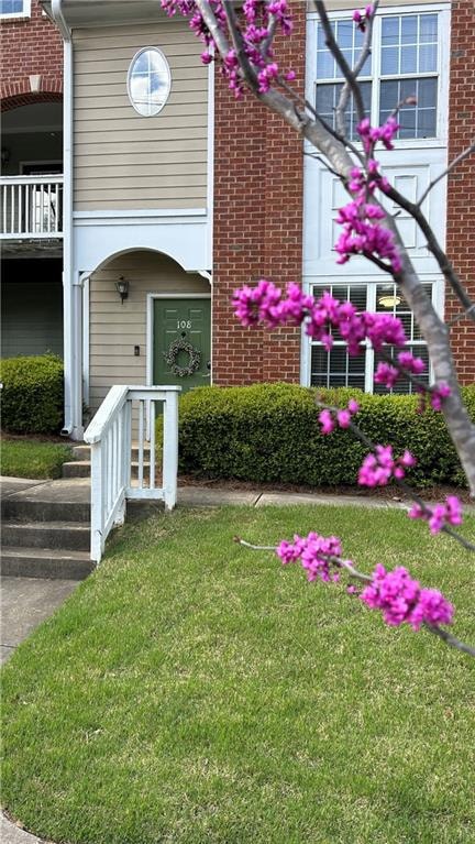 Charming front entry with classic brick façade and
