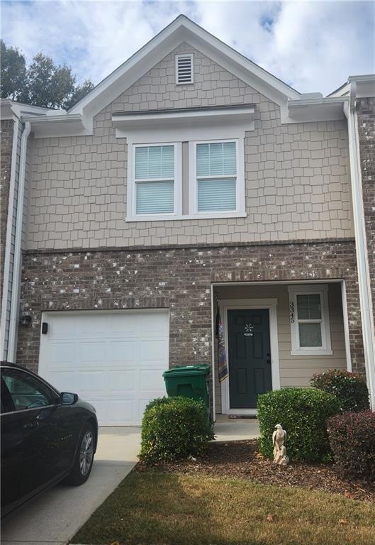 View of front of property with a garage