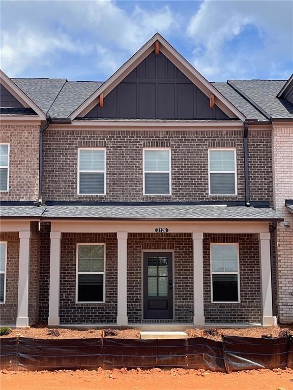 Aurora Elevation B.  Rear entry garage w porches facing the courtyard.