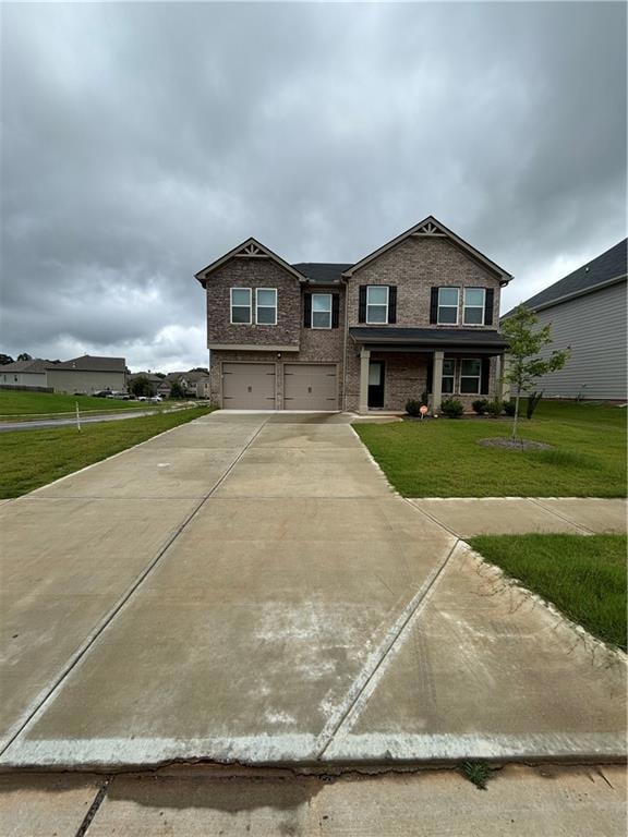 View of front of property featuring a garage and a