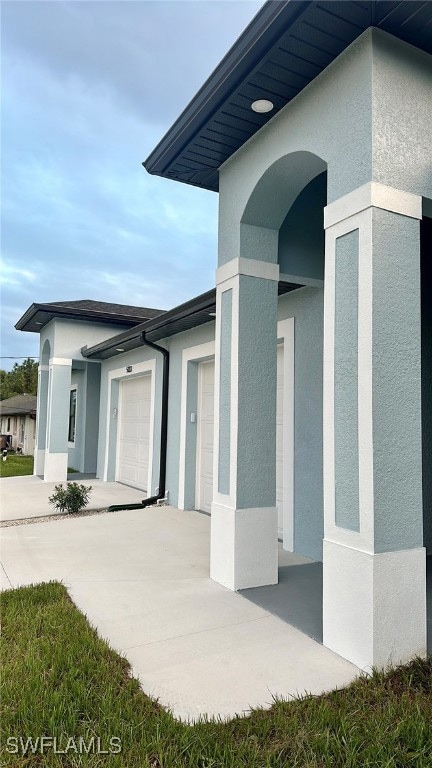 Entrance to property featuring a garage