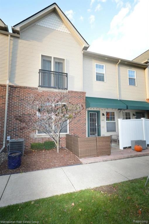 Front exterior with private brick patio