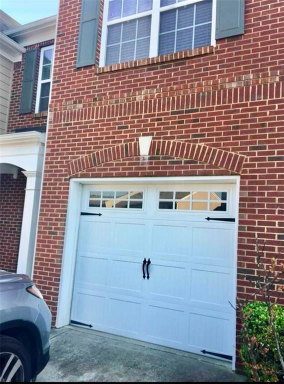 Garage featuring driveway