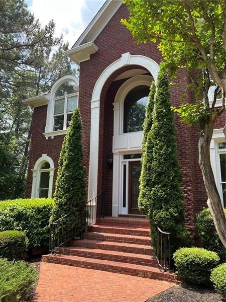 Four sides brick home in prestigious Sugarloaf Cou