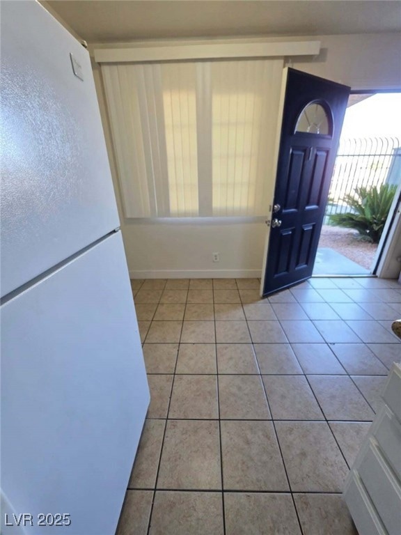 Entrance foyer featuring tile patterned floors