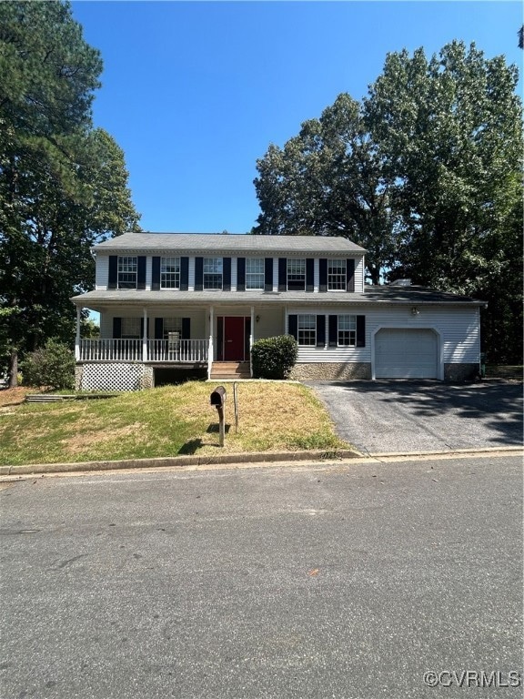 View of front of house featuring a garage, a front