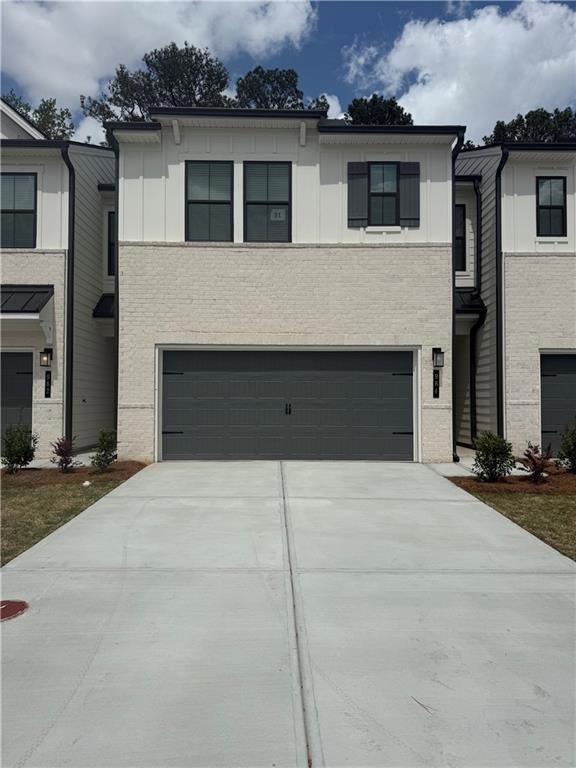 View of front of property with an attached garage,