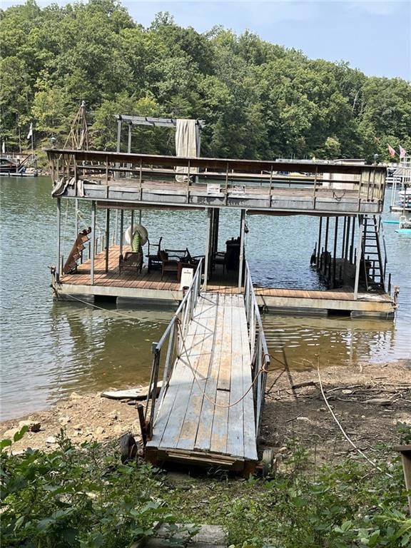 Dock area featuring a water view