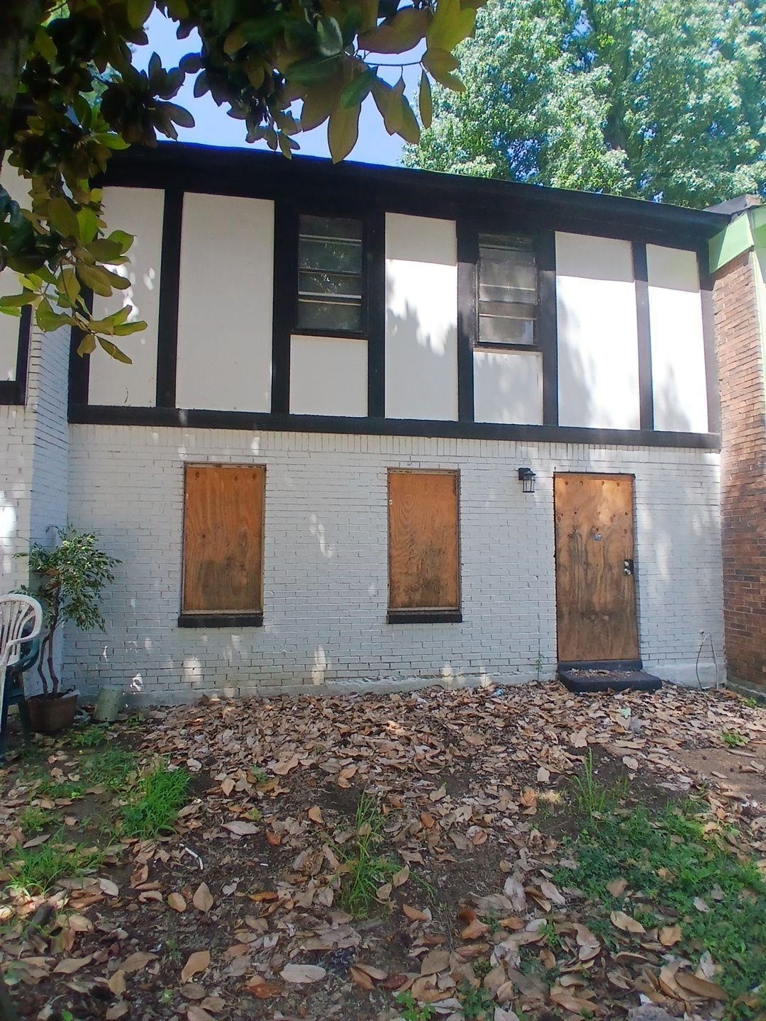 View of side of property featuring brick siding