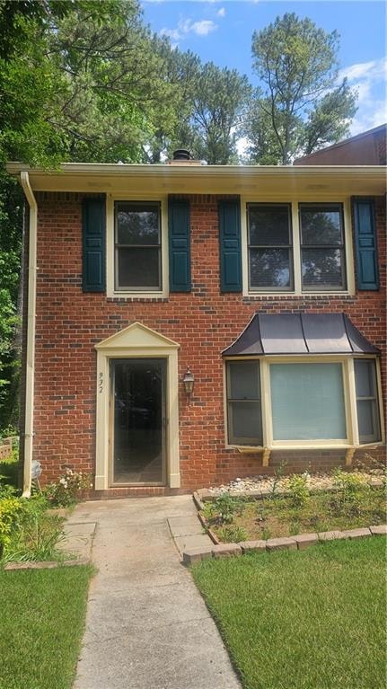 View of front of house featuring brick siding