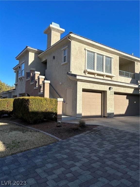 Exterior, 1 car garage adjacent to unit