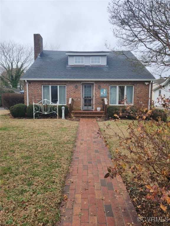 View of front of property featuring a shingled roo