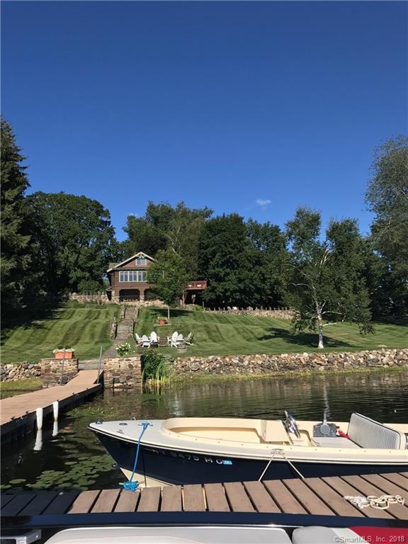 Sloping lawn to over 200 feet of waterfront. Woode