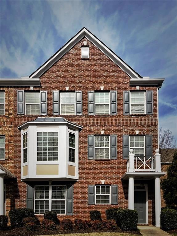 View of front of house with a balcony