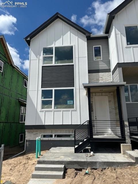 View of front of property with board and batten siding