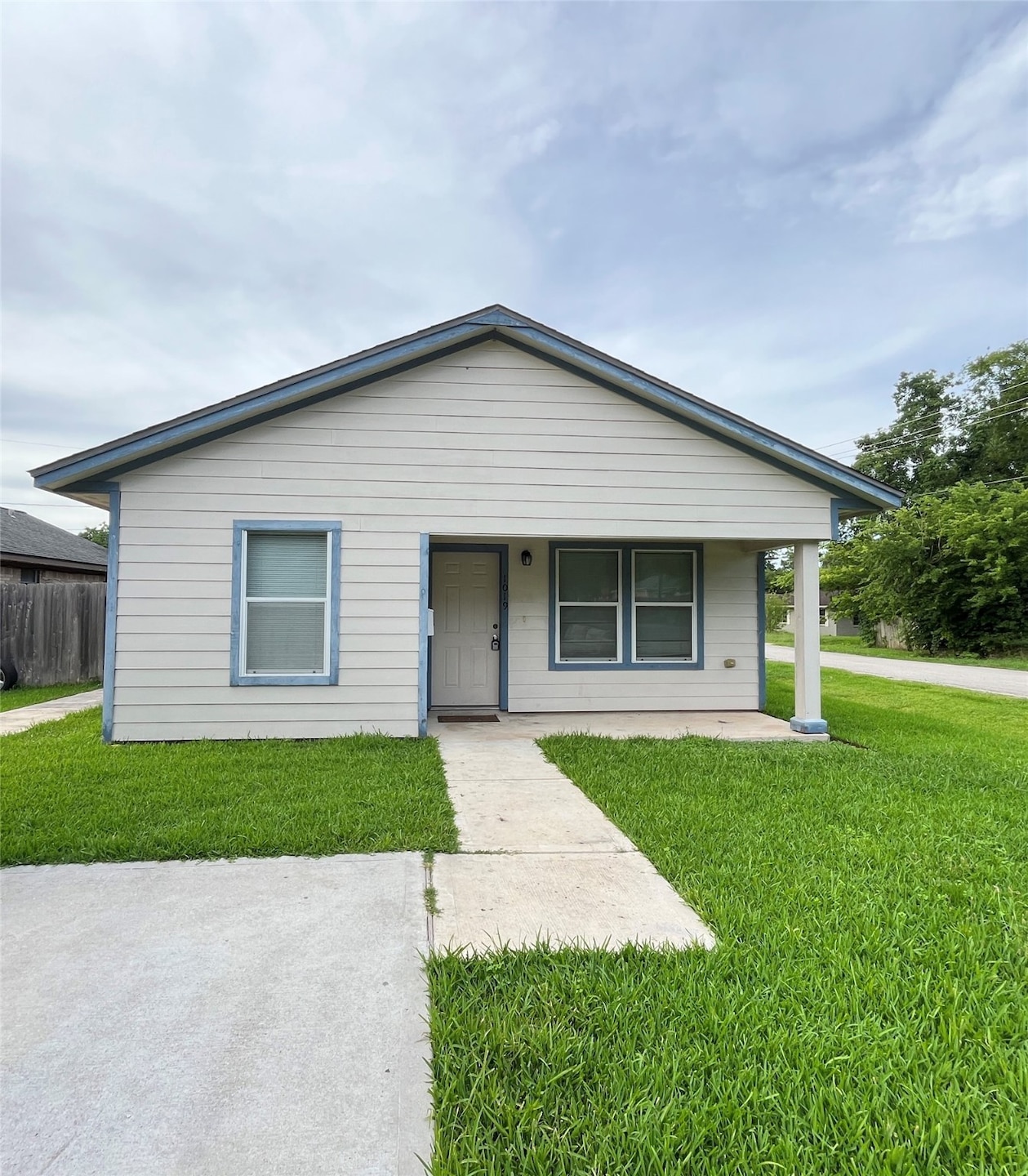 Front of the house features a covered porch