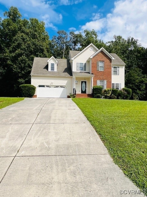 View of front of property with a front yard and a