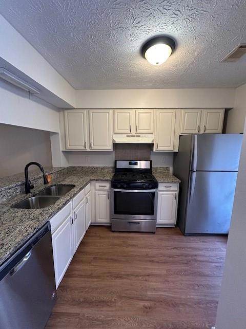 Kitchen featuring refrigerator, stainless steel el