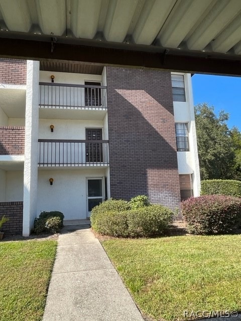 Ground level view. Second floor end unit. Standing
