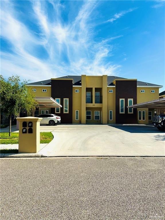 View of front of house with stucco siding