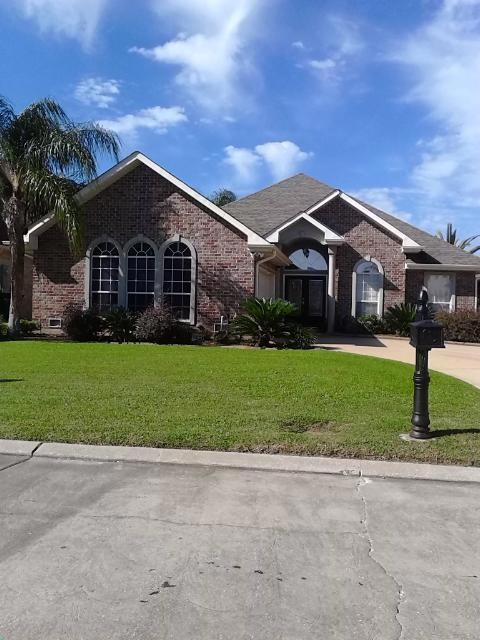Front Exterior of all brick home with two-car comp