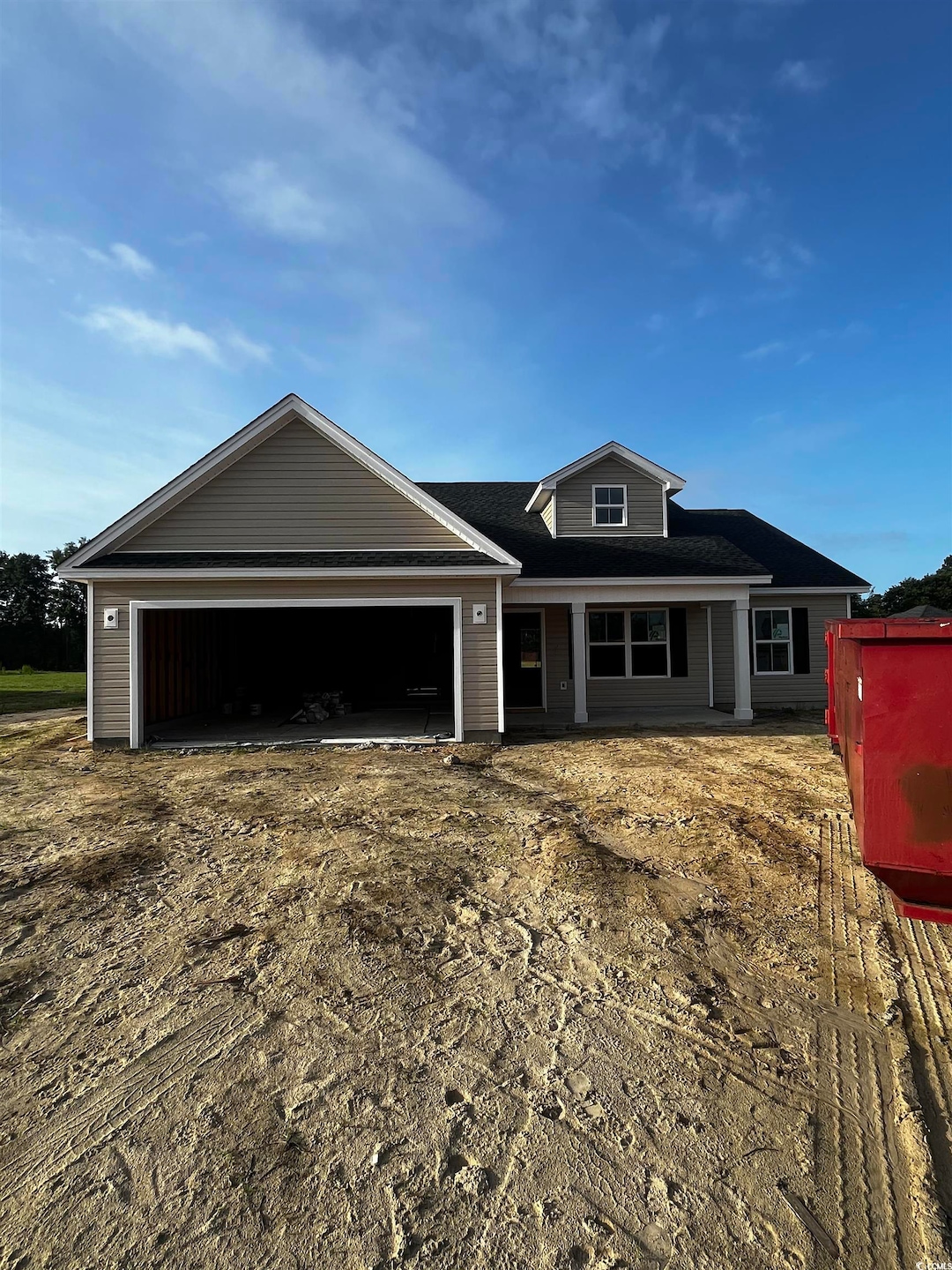 View of front of house with an attached garage and roof with shingles