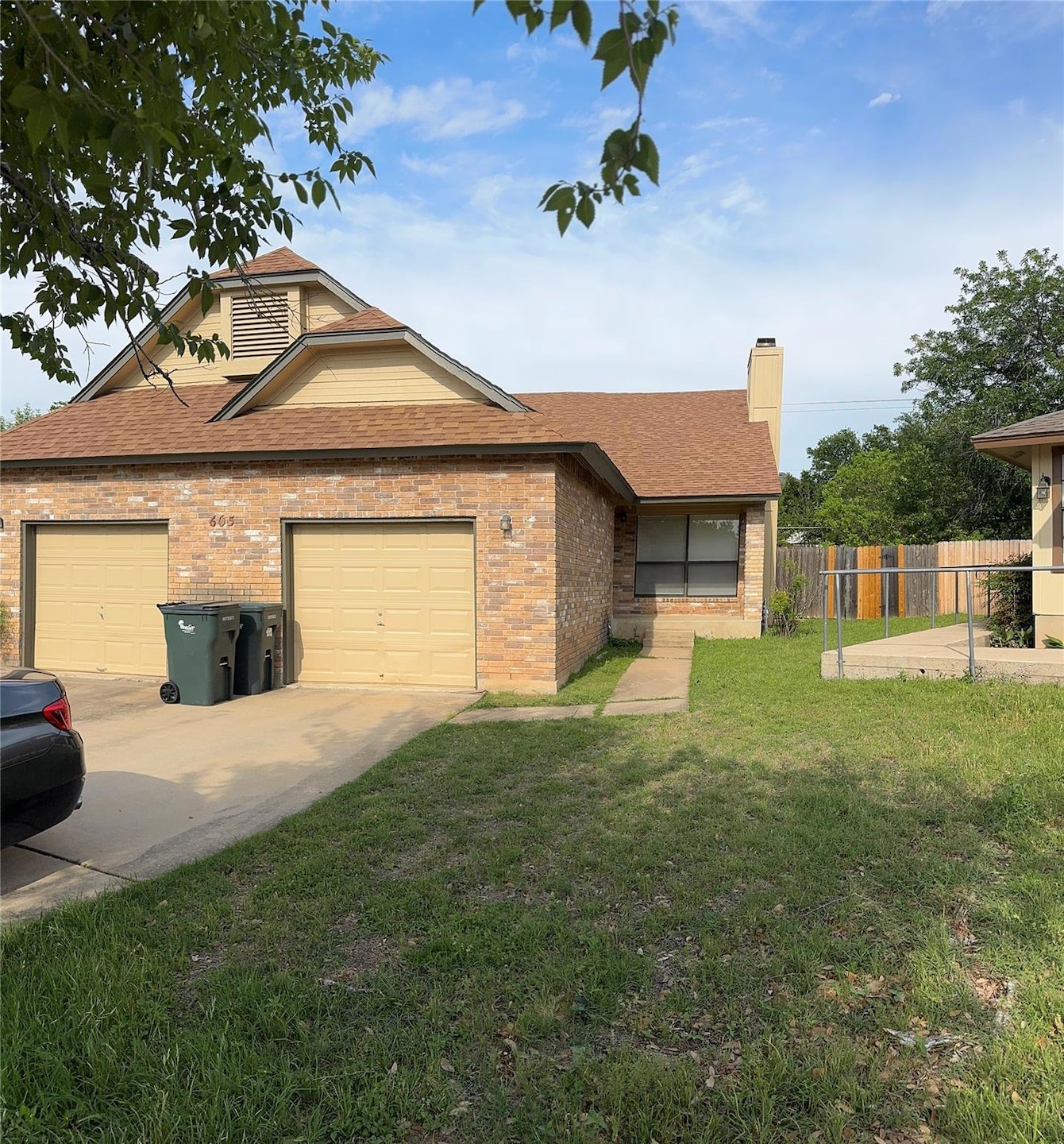 View of front of home featuring roof with shingle