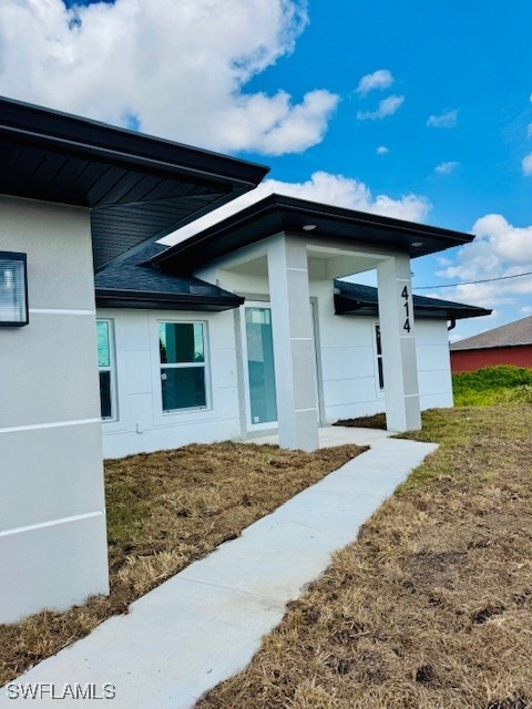 View of home's exterior featuring stucco siding an