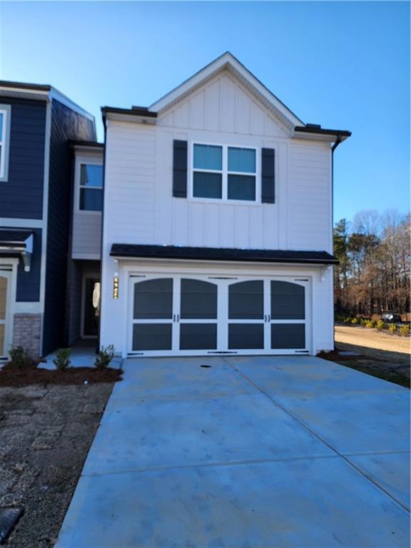 View of front of home featuring a garage