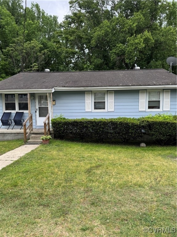 Ranch-style house with a front lawn, a porch, and